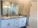 Elegant bathroom with double vanity and granite countertops at 932 Albertville Ct, Kissimmee, FL 34759