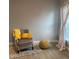 Relaxing bedroom with comfy chair and ottoman, plus large window at 932 Albertville Ct, Kissimmee, FL 34759