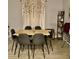 Dining room with light wood table and gray chairs at 932 Albertville Ct, Kissimmee, FL 34759