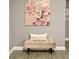 Entryway with bench and large floral wall art at 932 Albertville Ct, Kissimmee, FL 34759