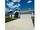 Two-car garage and well-maintained front yard at 932 Albertville Ct, Kissimmee, FL 34759