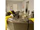 Living room with sectional sofa and yellow throw blankets at 932 Albertville Ct, Kissimmee, FL 34759