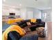 Open concept living room and kitchen with sectional sofa at 932 Albertville Ct, Kissimmee, FL 34759