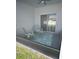 Cozy screened porch with seating area at 932 Albertville Ct, Kissimmee, FL 34759