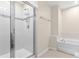 Modern bathroom showcasing a glass shower with white tile and decorative accents at 9475 Randal Park Blvd, Orlando, FL 32832