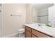 Charming bathroom with a single sink vanity, playful decor, and a shower with tiled accents at 9475 Randal Park Blvd, Orlando, FL 32832