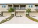 Exterior view of townhomes with attached garages and well-maintained landscaping at 9475 Randal Park Blvd, Orlando, FL 32832