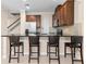 Open kitchen featuring a breakfast bar with seating, stainless steel appliances and tile backsplash at 9475 Randal Park Blvd, Orlando, FL 32832