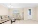 Bright living room with neutral walls, tile floors, and an inviting view of the outdoors at 9475 Randal Park Blvd, Orlando, FL 32832