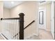 Top of the staircase with carpet floor and wood railings looking towards the bedrooms at 9475 Randal Park Blvd, Orlando, FL 32832