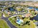 Aerial view of community including pool and lakefront property at 116 Candlewick Ct, Sanford, FL 32771