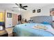 Primary bedroom with a queen bed, dresser, and ceiling fan at 116 Candlewick Ct, Sanford, FL 32771