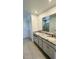 Double vanity bathroom with granite countertops at 11926 Sunsail Ave, Orlando, FL 32832