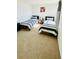 Bright bedroom with two twin beds and striped bedding at 11926 Sunsail Ave, Orlando, FL 32832