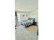 Spacious bedroom with a full bed and grey bedding at 11926 Sunsail Ave, Orlando, FL 32832