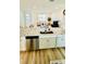 Open concept kitchen with island overlooking living room at 11926 Sunsail Ave, Orlando, FL 32832