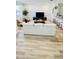 Open concept living area with hardwood floors and modern furniture at 11926 Sunsail Ave, Orlando, FL 32832