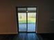 Sliding glass door leads to backyard view at 1421 Swift Ct, Poinciana, FL 34759
