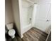 Simple bathroom with a shower/tub combo and toilet at 1421 Swift Ct, Poinciana, FL 34759