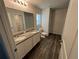 Bathroom boasts double vanity and granite countertop at 1421 Swift Ct, Poinciana, FL 34759
