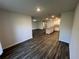 Dining area with wood-look floors and open concept to the kitchen at 1421 Swift Ct, Poinciana, FL 34759