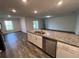 Kitchen with island, granite countertops, and stainless steel appliances at 1421 Swift Ct, Poinciana, FL 34759