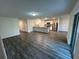 Open living area with kitchen and access to the back patio at 1421 Swift Ct, Poinciana, FL 34759