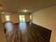 Spacious living room with sliding glass doors leading to the patio at 1421 Swift Ct, Poinciana, FL 34759