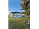 Single-story home with backyard, grassy lawn and patio at 1625 Hill Park Dr, Deltona, FL 32725