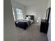 Cozy bedroom with full-size bed and dresser at 1625 Hill Park Dr, Deltona, FL 32725