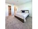 Spacious primary bedroom with large bed, walk-in closet, and ensuite bathroom at 1625 Hill Park Dr, Deltona, FL 32725
