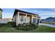 House front with nicely landscaped yard at 1625 Hill Park Dr, Deltona, FL 32725