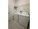 Bright laundry room with washer and dryer and storage at 1625 Hill Park Dr, Deltona, FL 32725