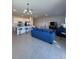 Open floorplan with kitchen island and comfortable living space at 1625 Hill Park Dr, Deltona, FL 32725