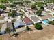 Aerial view of the house in the neighborhood, showcasing its backyard and surroundings at 1804 Westminster Trl, Clermont, FL 34714
