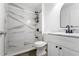 Contemporary bathroom features a marble-tiled shower at 1804 Westminster Trl, Clermont, FL 34714
