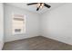 Bedroom with natural light, neutral walls, and sleek wood-look flooring at 1804 Westminster Trl, Clermont, FL 34714