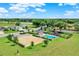 Aerial shot of a community pool area with playground and ample parking for residents at 1804 Westminster Trl, Clermont, FL 34714
