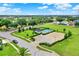 Community pool and play area are surrounded by lush landscaping and ample parking at 1804 Westminster Trl, Clermont, FL 34714