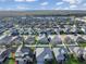 Community overview with lake and many houses at 1850 Patriot Way, Saint Cloud, FL 34769