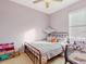 Cozy bedroom with full-size bed, crib, and plenty of storage at 1850 Patriot Way, Saint Cloud, FL 34769