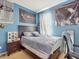 Bedroom with a full-size bed, and unique decor at 1850 Patriot Way, Saint Cloud, FL 34769