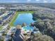 Aerial view of community pool and lake at 1850 Patriot Way, Saint Cloud, FL 34769