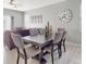 Bright dining room features a table with six chairs, and hardwood floors at 1850 Patriot Way, Saint Cloud, FL 34769