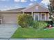 Attractive one-story home with landscaped yard and two-car garage at 1850 Patriot Way, Saint Cloud, FL 34769