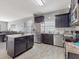 Modern kitchen with stainless steel appliances and an island at 1850 Patriot Way, Saint Cloud, FL 34769