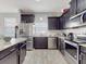 Modern kitchen with stainless steel appliances and an island at 1850 Patriot Way, Saint Cloud, FL 34769