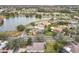 Aerial view of a residential neighborhood near a lake and golf course at 243 New River Dr, Kissimmee, FL 34759