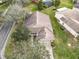 Single-Gathering home with a gray roof and a brick driveway at 243 New River Dr, Kissimmee, FL 34759