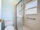 Updated bathroom with walk-in shower and neutral tile at 243 New River Dr, Kissimmee, FL 34759